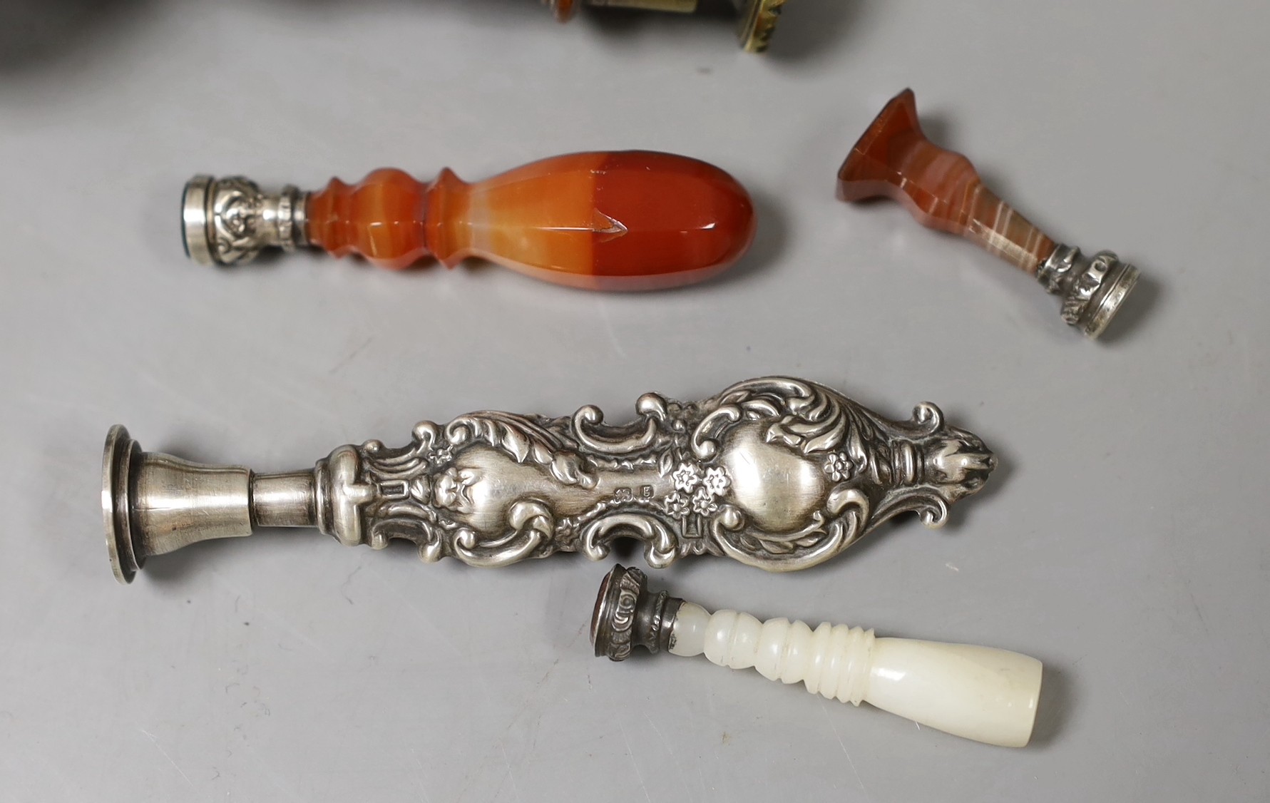 Four 19th century decorative handled seals and a larger wooden handles seal-9cms long